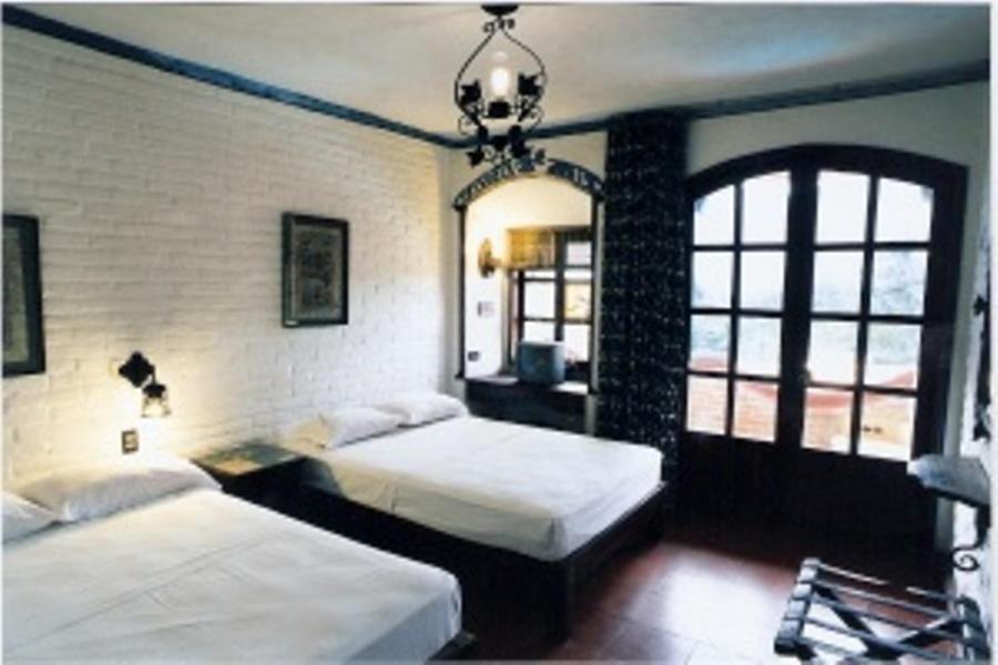 Habitación Doble con 2 camas dobles (1-4 adultos)