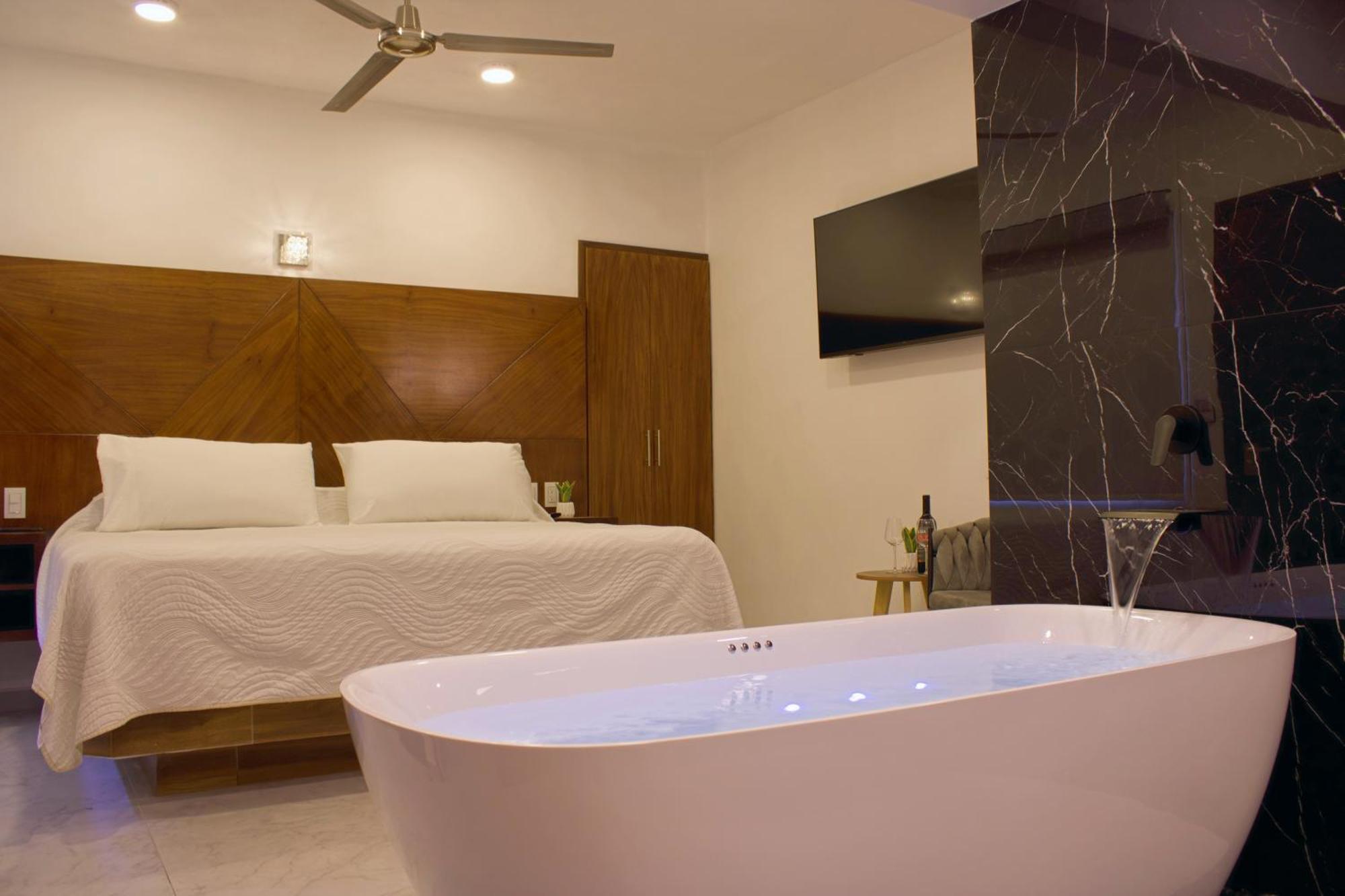 Suite con bañera de hidromasaje - Cama extragrande